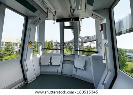 Automated sky train cabin interior without driver