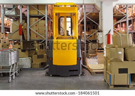 High rack stacker forklift truck in distribution warehouse
