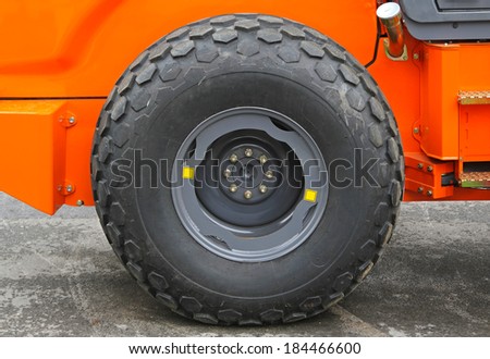 Big tire at orange construction machine