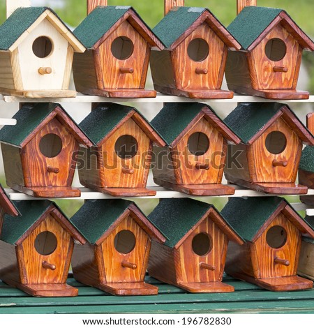 New bird houses made from wood with green roof