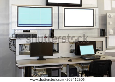 Security surveillance center with monitors and screens