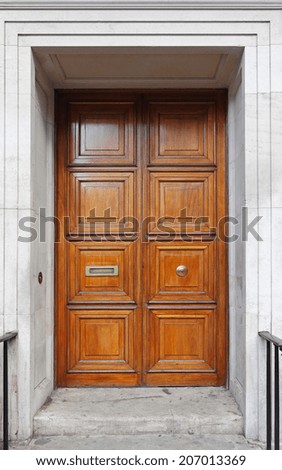 Closed big brown wood double door