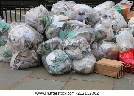 Big pile of trash bags due municipal union worker strike
