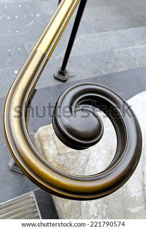 Brass hand rail with spiral shape end