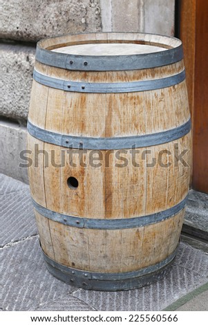 Traditional vine barrel made from oak wood with metal hoops