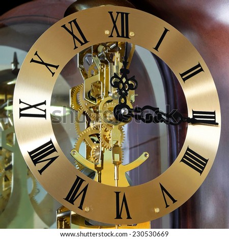 Close up shot of analogue gold clock