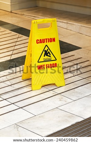 Yellow caution sign for wet floor warning