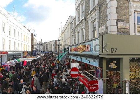 LONDON, UNITED KINGDOM - NOVEMBER 23: Portobello Road Market London on NOVEMBER 23, 2013. Portobello Road Market crowded with shoppers onSaturday in London, United Kingdom.