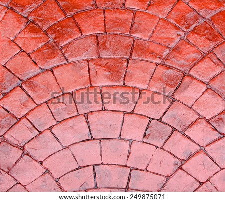 Detail of shiny road made of red cobble