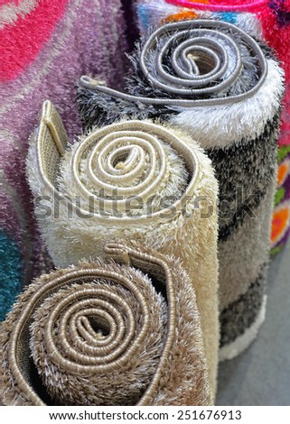 Synthetic carpets and rugs in rolls