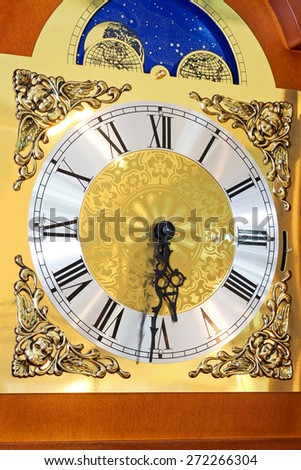 Close up shot of clock dial in gold