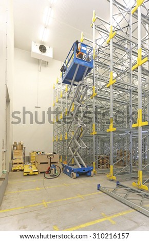 Scissor Lift at Construction Site in Distribution Warehouse