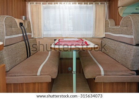 Camping van interior with seating for four