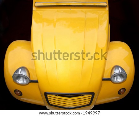 Old timer yellow car on angle from above