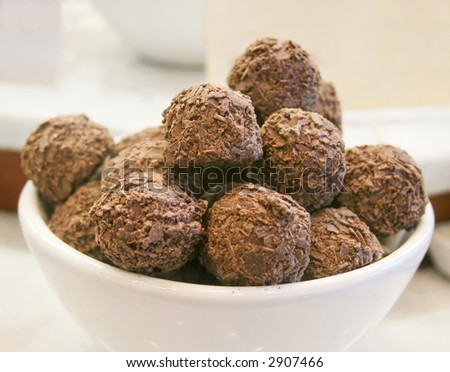 Dark chocolate truffles in the white bowl