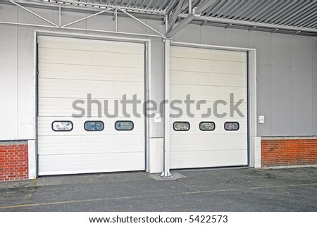 Big storage house loading double white door