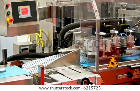 Close up shot of automated packaging machine