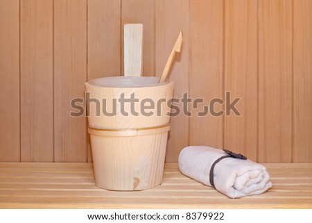 Wooden bucket and ladle in sauna cabin