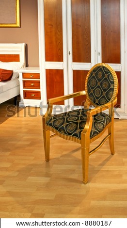 Vintage golden chair in old bed room