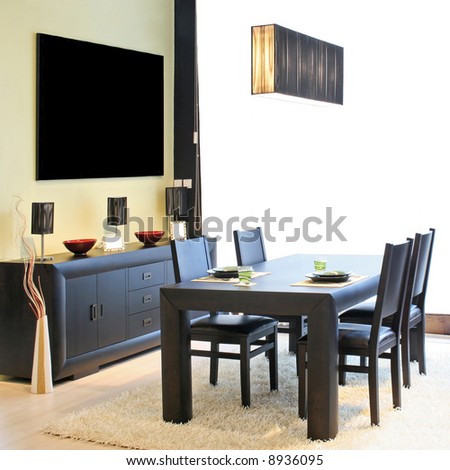 Modern dinning room with black table and closet