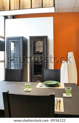Modern dinning room with black table and closet
