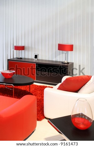 Modern living room with red and black furniture