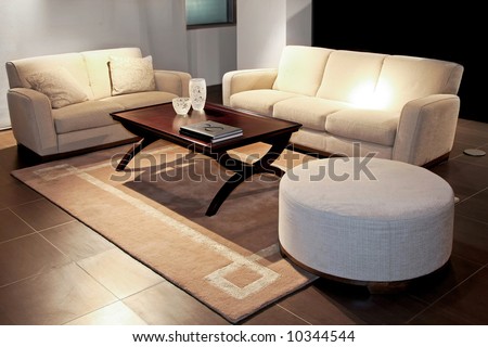 Modern living room with two beige sofas