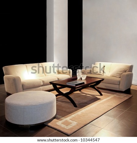 Modern living room with two beige sofas