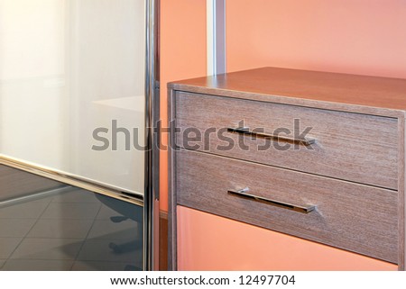 Two wooden shelves in big wardrobe closet
