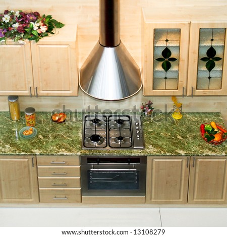 Small kitchen counter with stove and ventilation