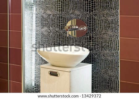 Contemporary bathroom design with broken mirror wall