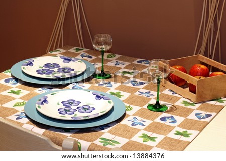 Table for two with tableware and apples