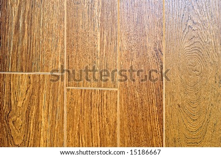 Textured brown hard wood tiles for flooring