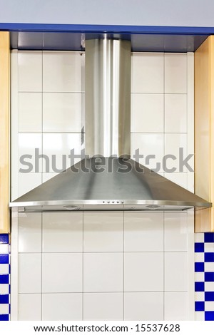 Stainless steel air ventilation in blue kitchen