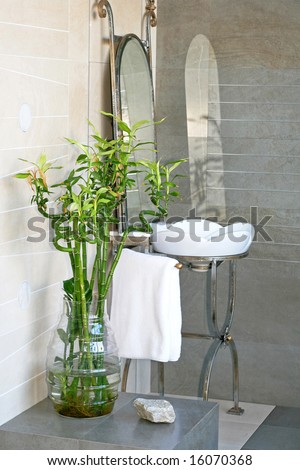Ironwork basin in bathroom with bamboo plant