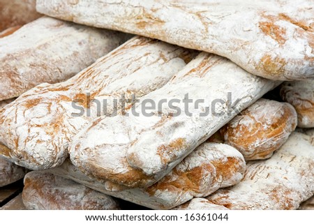 Bunch of white bread sticks on the market