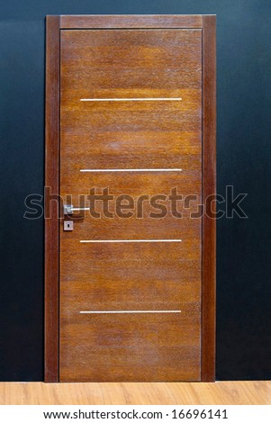 Closed brown wood door in home interior