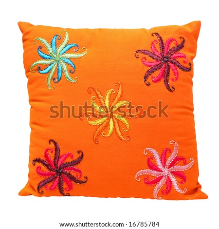 Orange pillow with floral decoration isolated on white