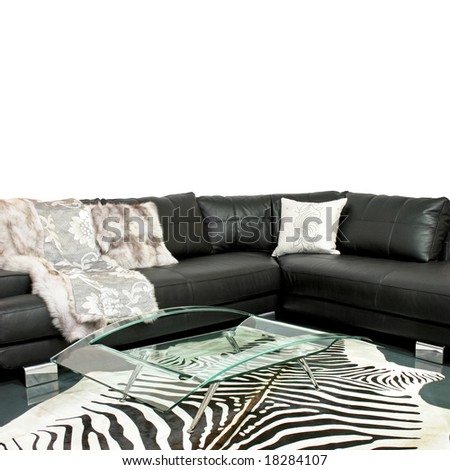 Living room with zebra hide and leather sofa