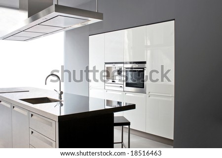 Interior of big white kitchen in apartment