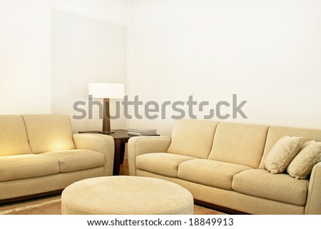 Living room with two beige textile sofas