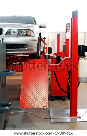 Auto service garage with car at lift