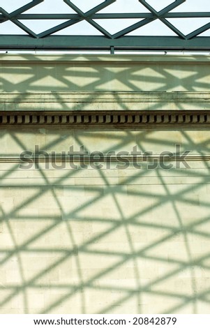 Geometric architecture shadows at the stone wall