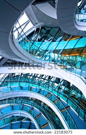 Curved staircase in big glass office building