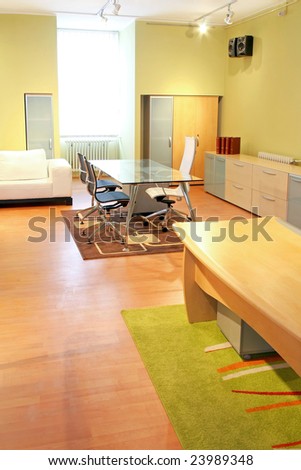 Big office room with glass conference table