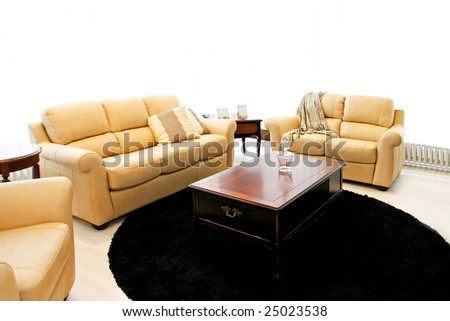 Classic living room with beige leather sofas