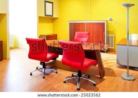 Empty bright office with warm color furniture