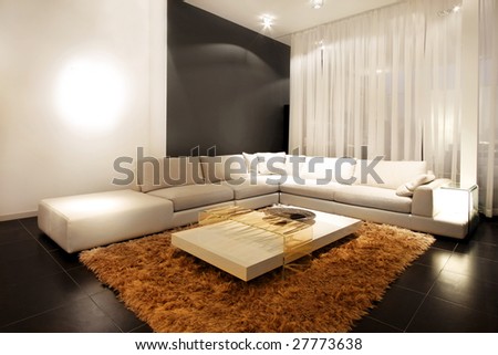 Interior of living room with sofa in corner