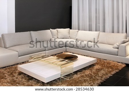 Interior of living room with settee in corner