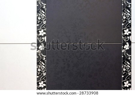 Black ceramic tiles with floral decor details